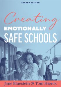 Creating Emotionally Safe Schools, Second Edition by Jane Bluestein and Tom Hierck; a group of students and two young girls in the front hugging in a school hallway.