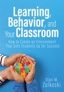 Learning, Behavior, and Your Classroom: How to Create an Environment That Sets Students Up for Success By Staci M. Zolkoskiy; a colorful puzzle-themed heart held by two hands on a blue background.